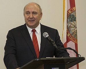 herman j russomanno at a podium